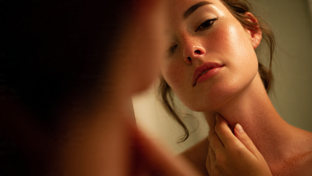 Neck lymph drainage massage for facial puffiness reduction