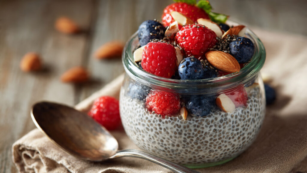 Chia pudding with berries showing high fiber food for weight loss.