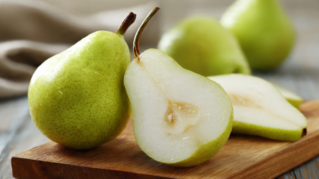 Fresh pear sliced showing high fiber fruit for weight loss plan.