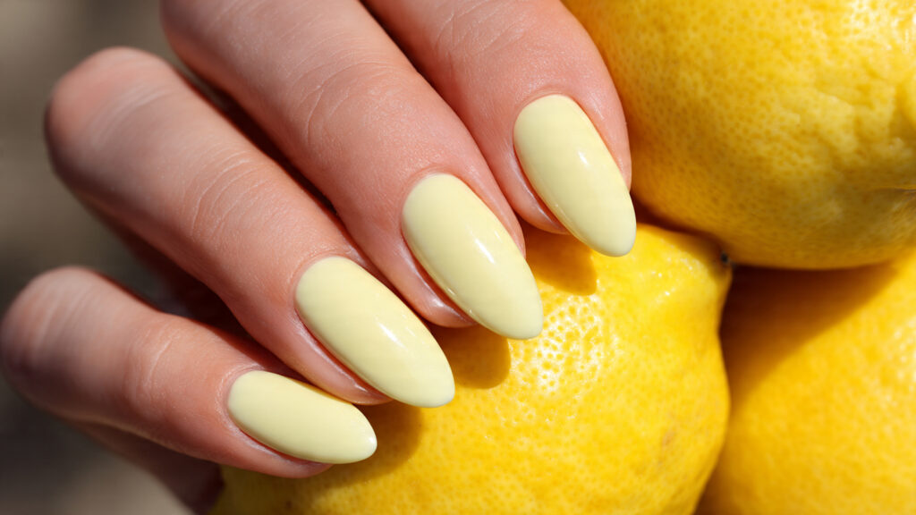 Butter yellow March nails for soft spring look.