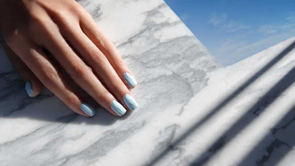 Minimal sky blue line art March nails design.