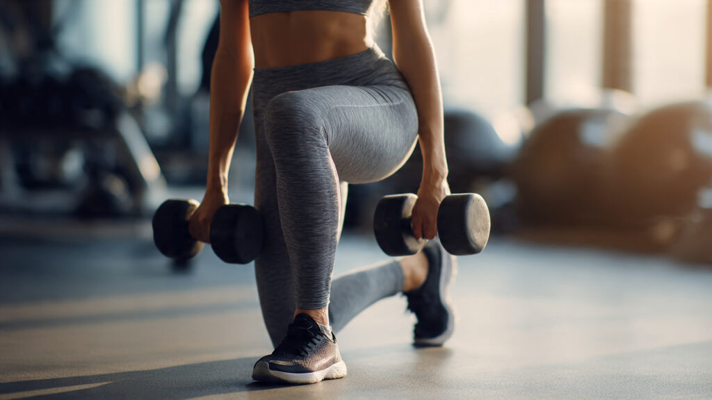 Curtsy lunge targeting glutes and outer thighs.