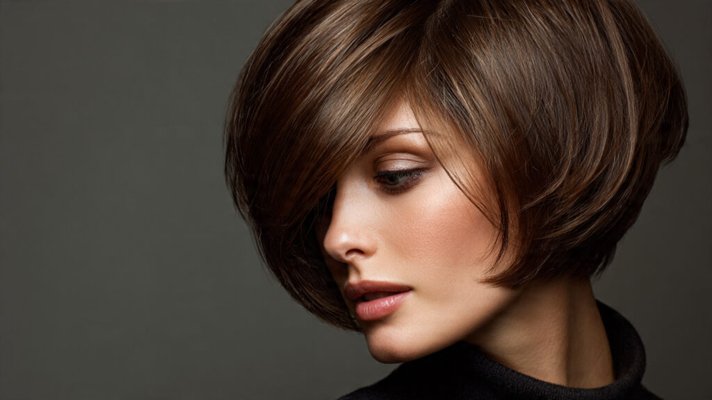 Bixie cut styled with a deep side part for elegance