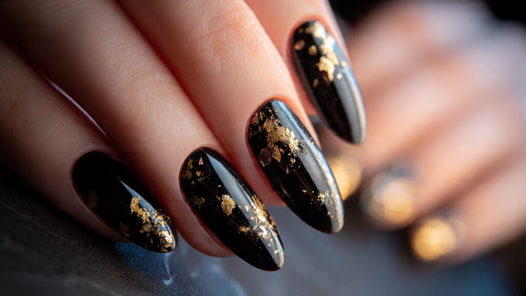 black nails with gold foil design
