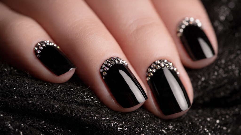black nails with rhinestone accents