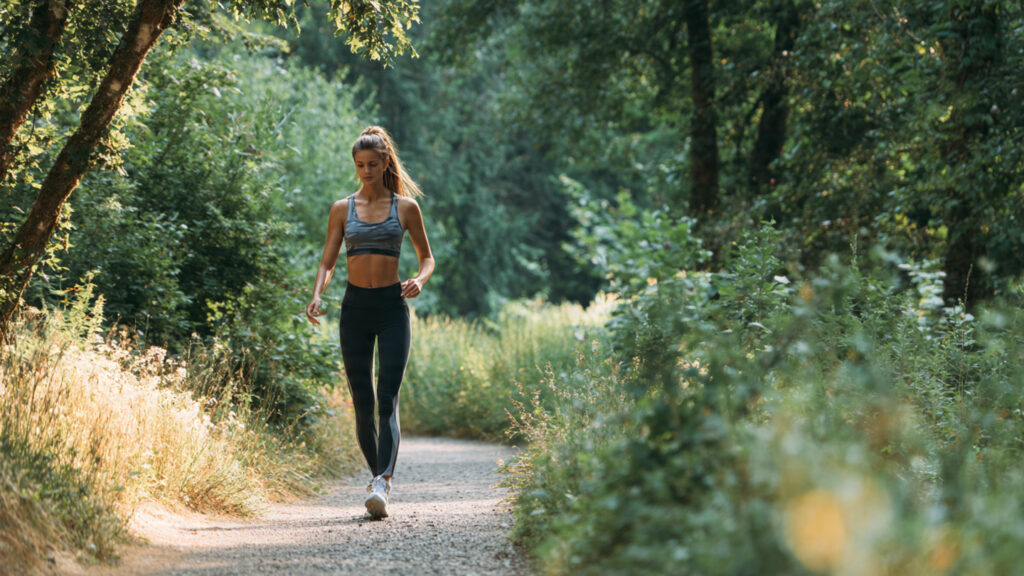 Walking fitness routine outdoors.