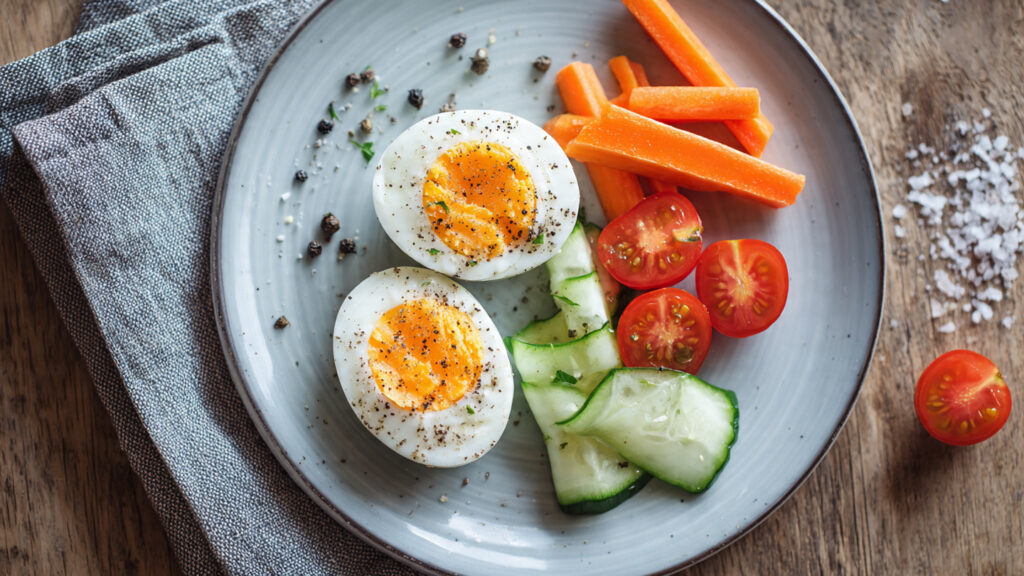 hard boiled eggs and vegetables healthy snack plate