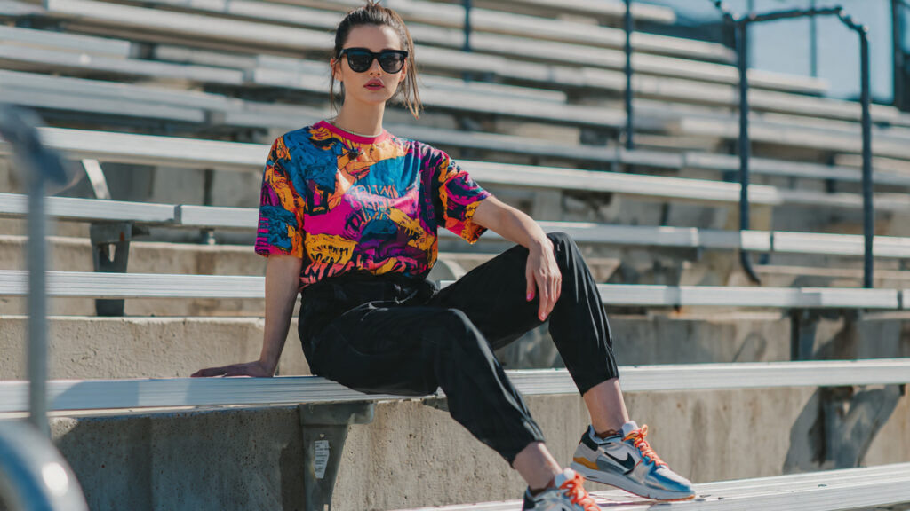 Graphic tee tucked into joggers for a casual baseball game outfit