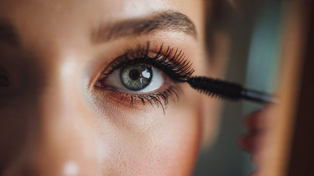 applying mascara for natural soft glow makeup